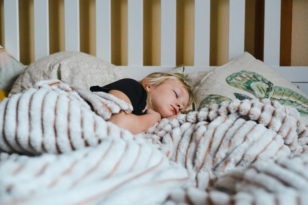 A child sleeping peacefully in bed